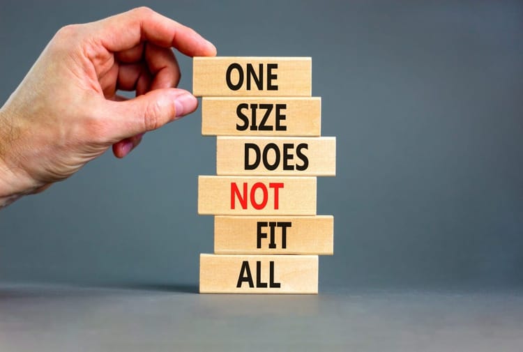 Image of a person building blocks that says "One Size Does Not Fit All"